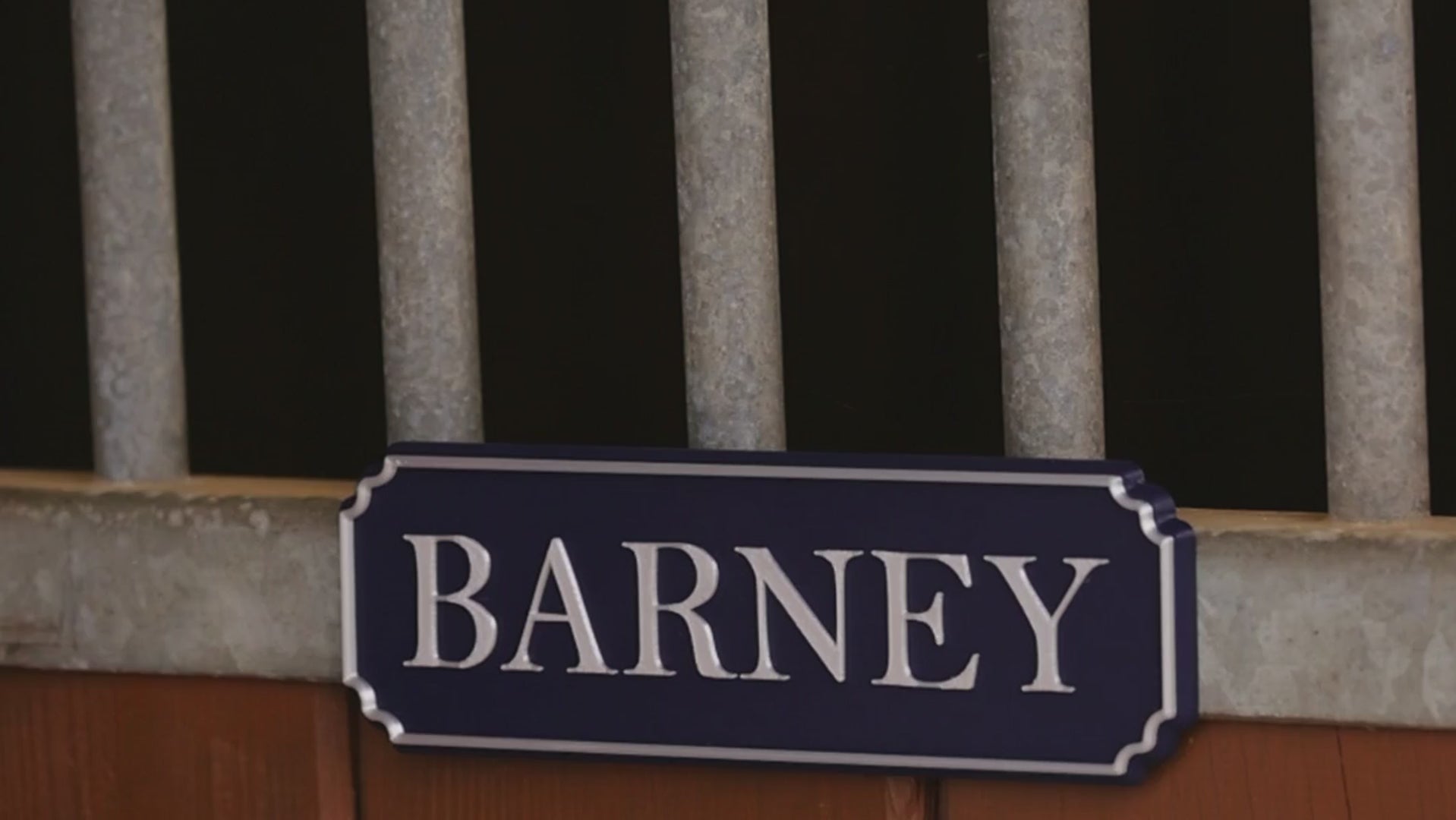 Load video: SnapTack magnetic name plate snapping onto a stable door (widescreen)