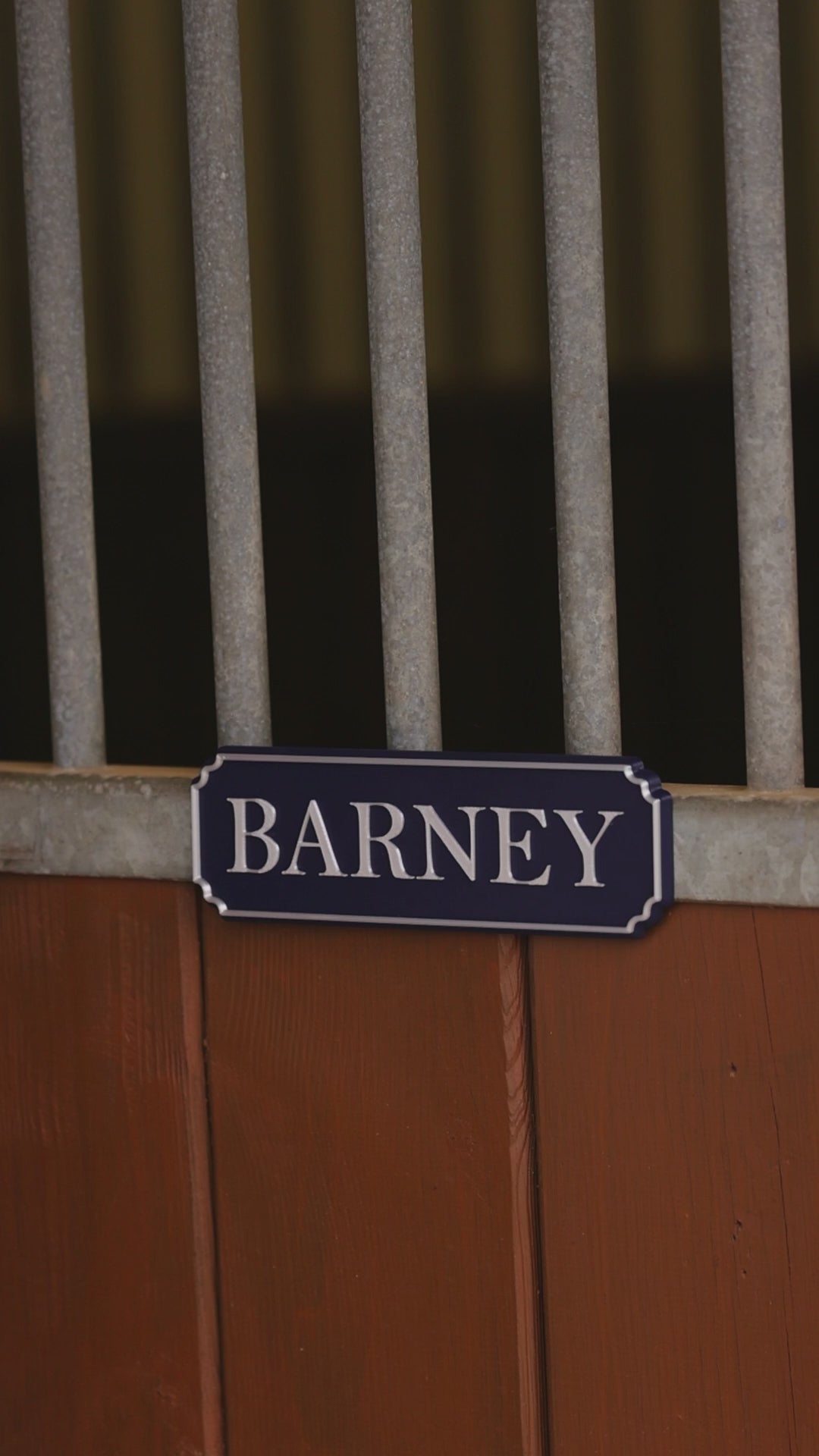 SnapTack magnetic name plate snapping onto a stable door