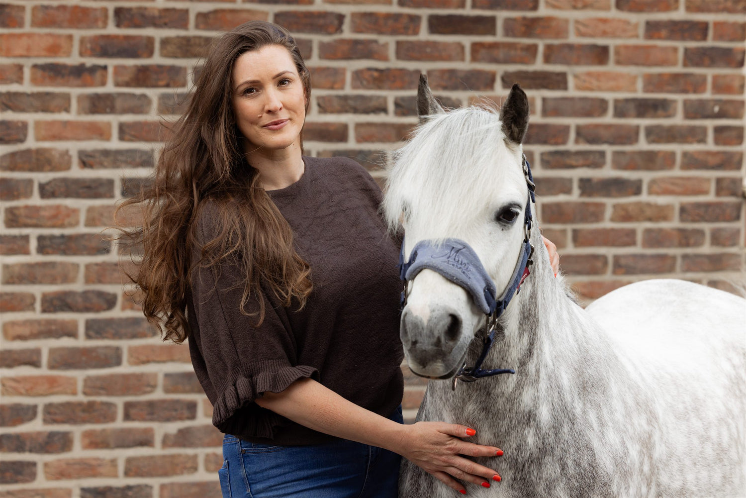 SnapTack founder with grey pony at the yard