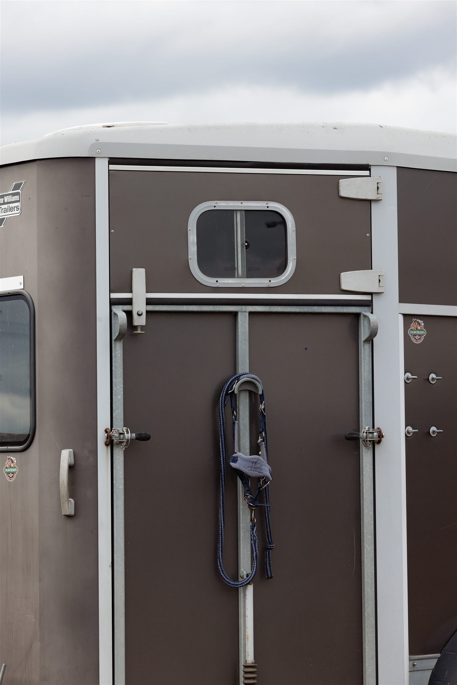 SnapTack magnetic bridle holder with hook on the back of a horsebox