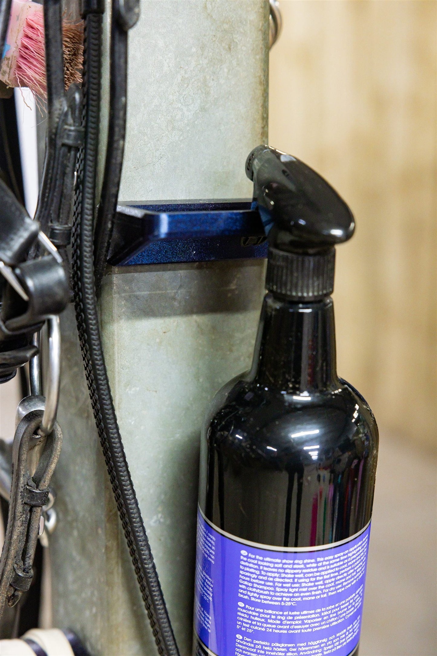 SnapTack magnetic spray bottle holder in use at the wash bay