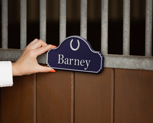 Render: placing a SnapTack magnetic door sign with a horseshoe and the name Barney onto a stable door